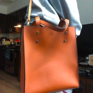 Brown handbag with shoulder strap